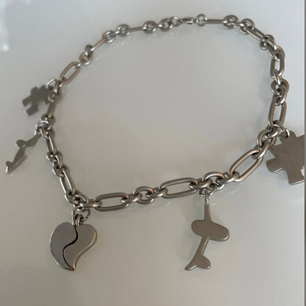 Silver Charm Necklace with Puzzle, Heart, and Airplane Charms
